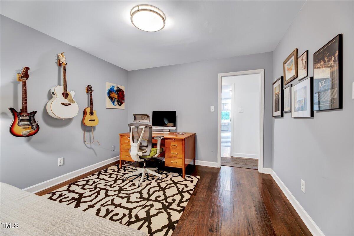11313 Rumshill Road Raleigh, NC 27614 - Photo 24 of 55 a bedroom with furniture and a wooden floor