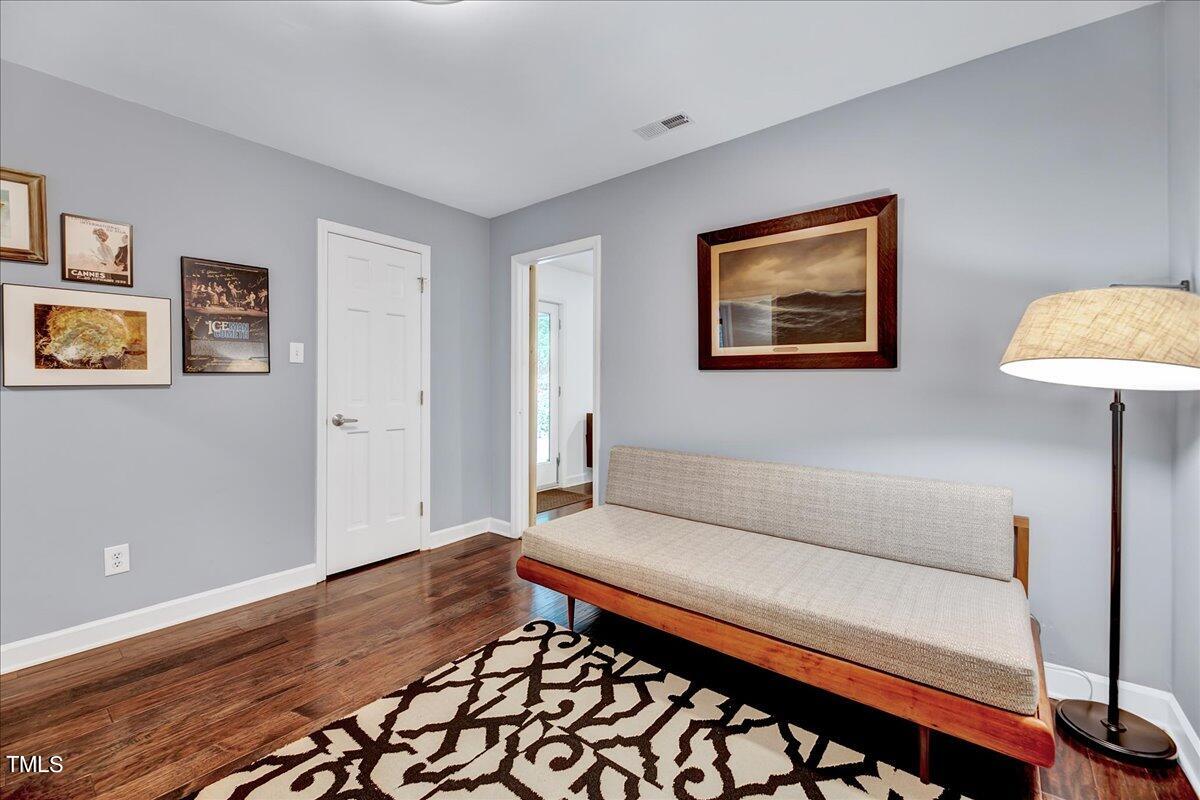 11313 Rumshill Road Raleigh, NC 27614 - Photo 26 of 55 a living room with furniture and a wooden floor