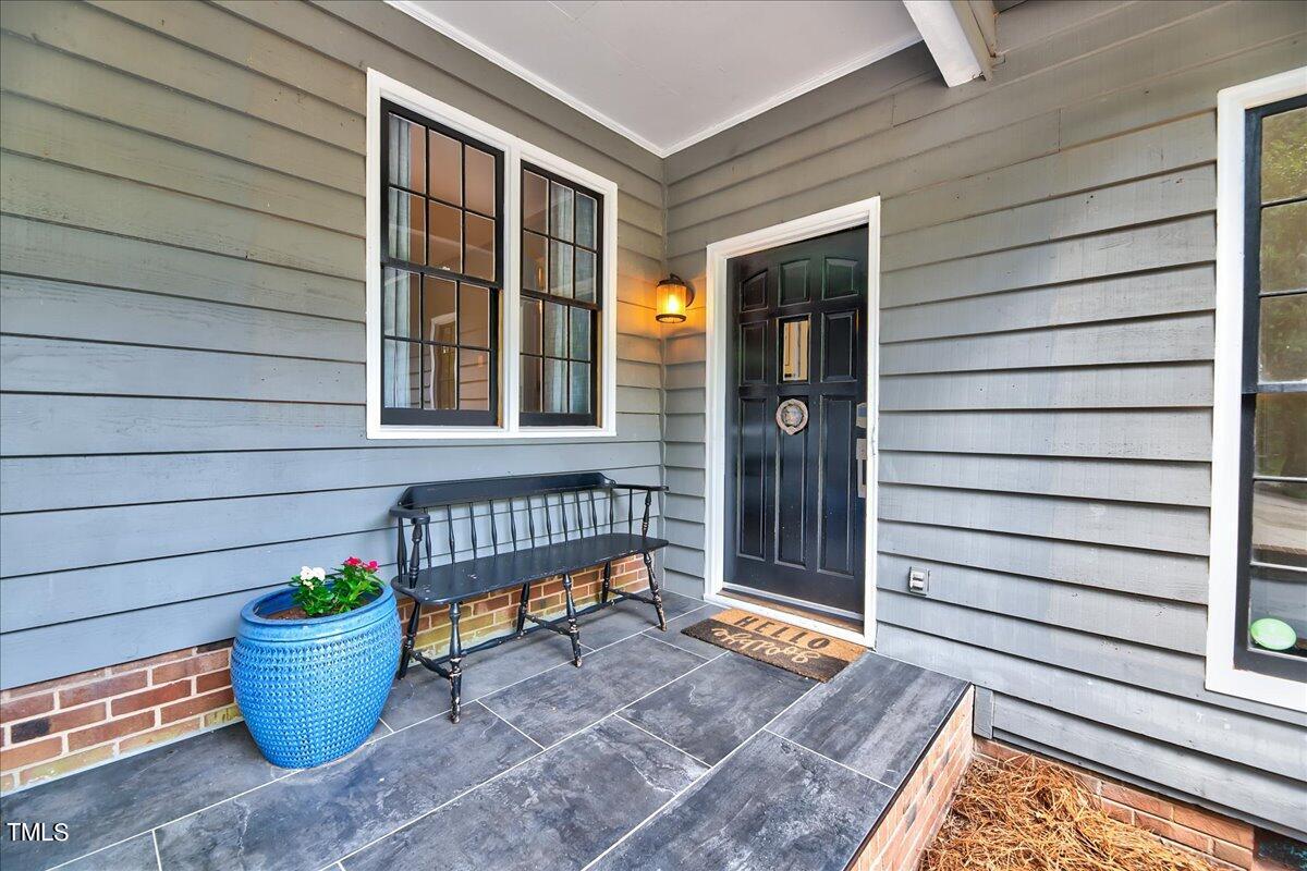 11313 Rumshill Road Raleigh, NC 27614 - Photo 3 of 55 a backyard of a house with dining table and chairs