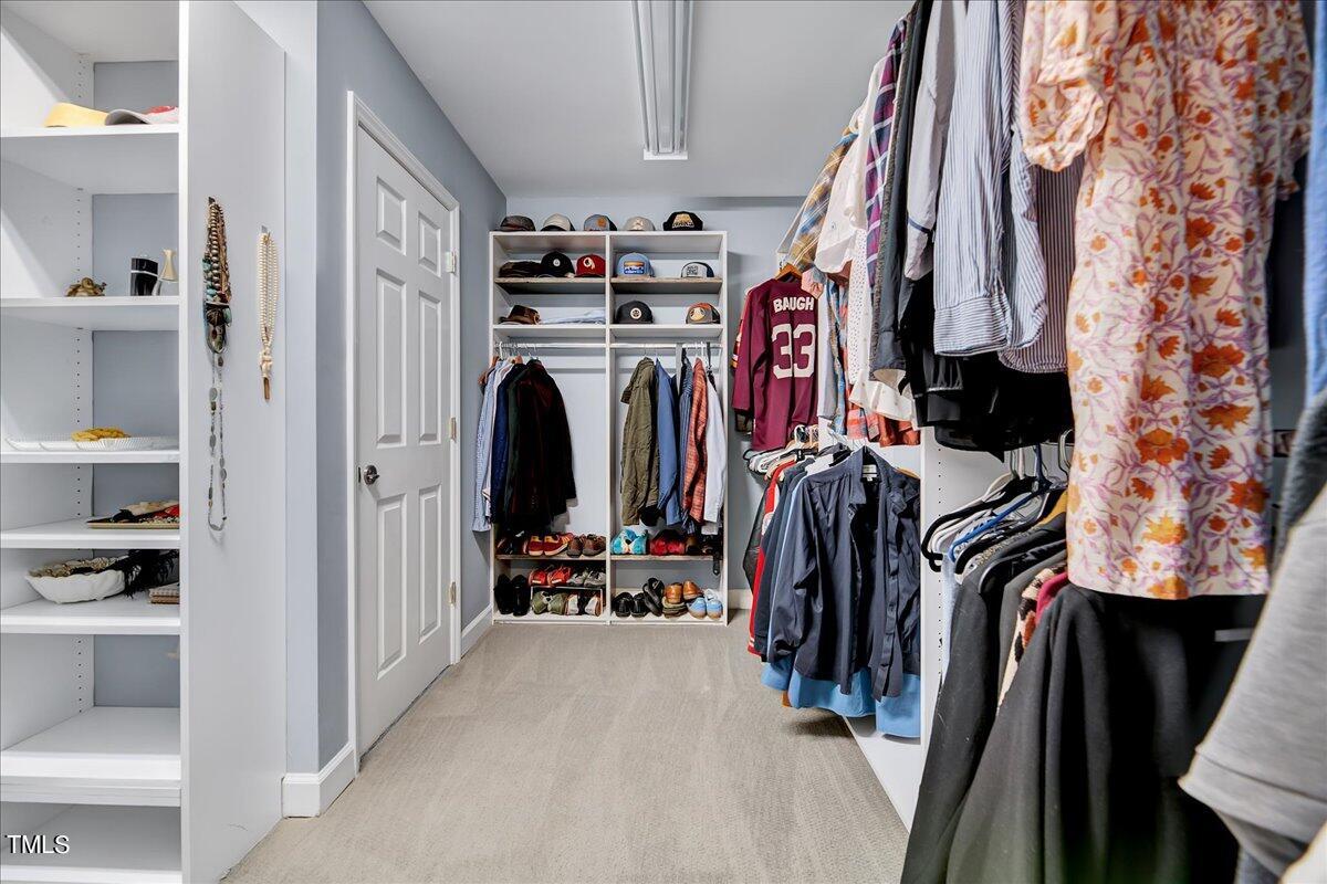 11313 Rumshill Road Raleigh, NC 27614 - Photo 38 of 55 a view of walk in closet with clothes and shoes