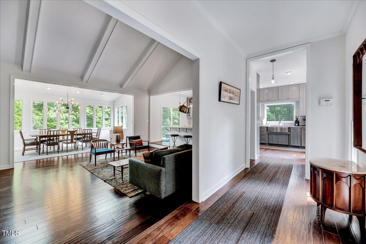 11313 Rumshill Road Raleigh, NC 27614 - Photo 4 of 55 a living room with furniture wooden floor and a large window