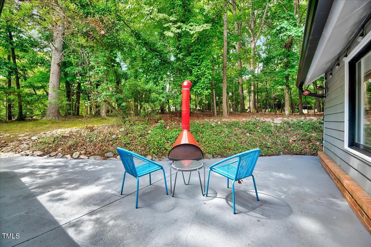 11313 Rumshill Road Raleigh, NC 27614 - Photo 44 of 55 a table and chairs in the patio