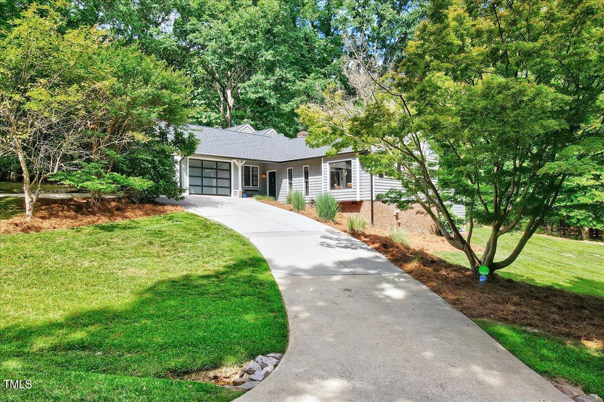 11313 Rumshill Road Raleigh, NC 27614 - Photo 49 of 55 a front view of a house with a garden