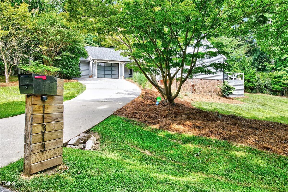 11313 Rumshill Road Raleigh, NC 27614 - Photo 51 of 55 a front view of a house with garden