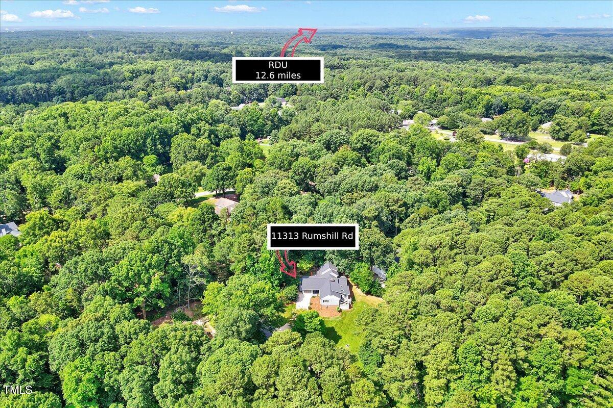 11313 Rumshill Road Raleigh, NC 27614 - Photo 52 of 55 a view of a lush green field