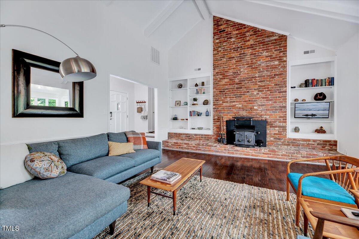 11313 Rumshill Road Raleigh, NC 27614 - Photo 9 of 55 a living room with furniture and a fireplace