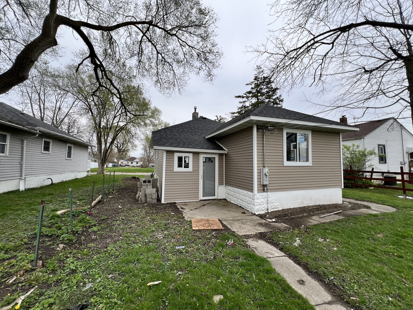 329 Albert Boulevard Kankakee, IL 60901 - Photo 14 of 15 a view of a house with yard and a tree