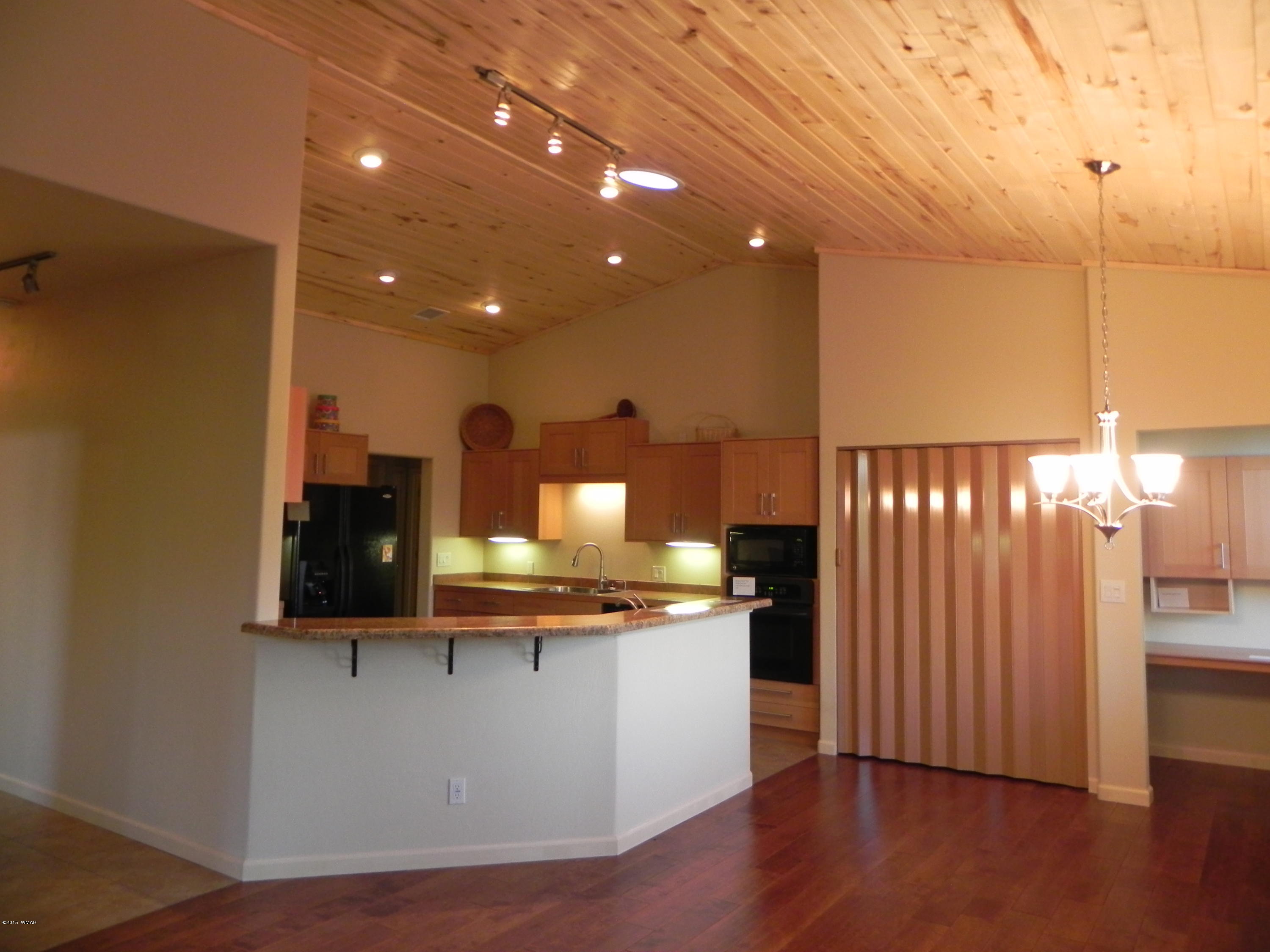 5975 Luminary Way Lakeside, AZ 85929 - Photo 16 of 44 a view of a kitchen with a sink and wooden floor