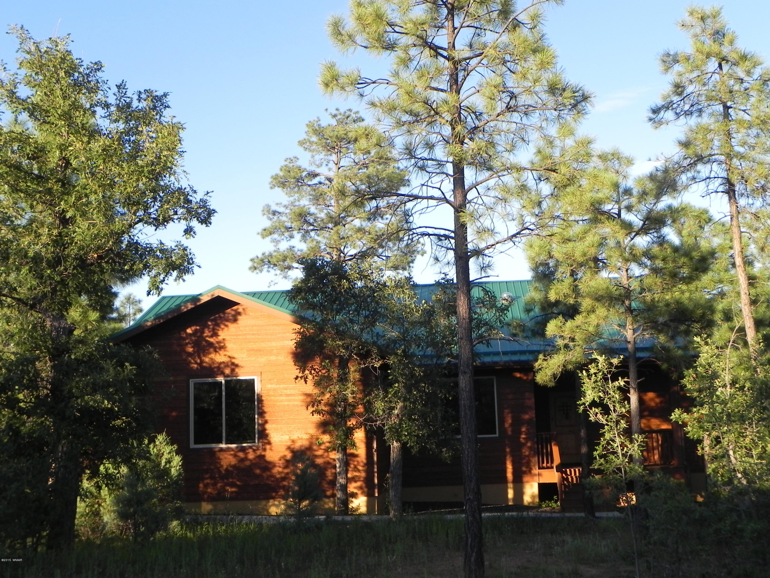 5975 Luminary Way Lakeside, AZ 85929 - Photo 3 of 44 a view of a house with a tree in front of it