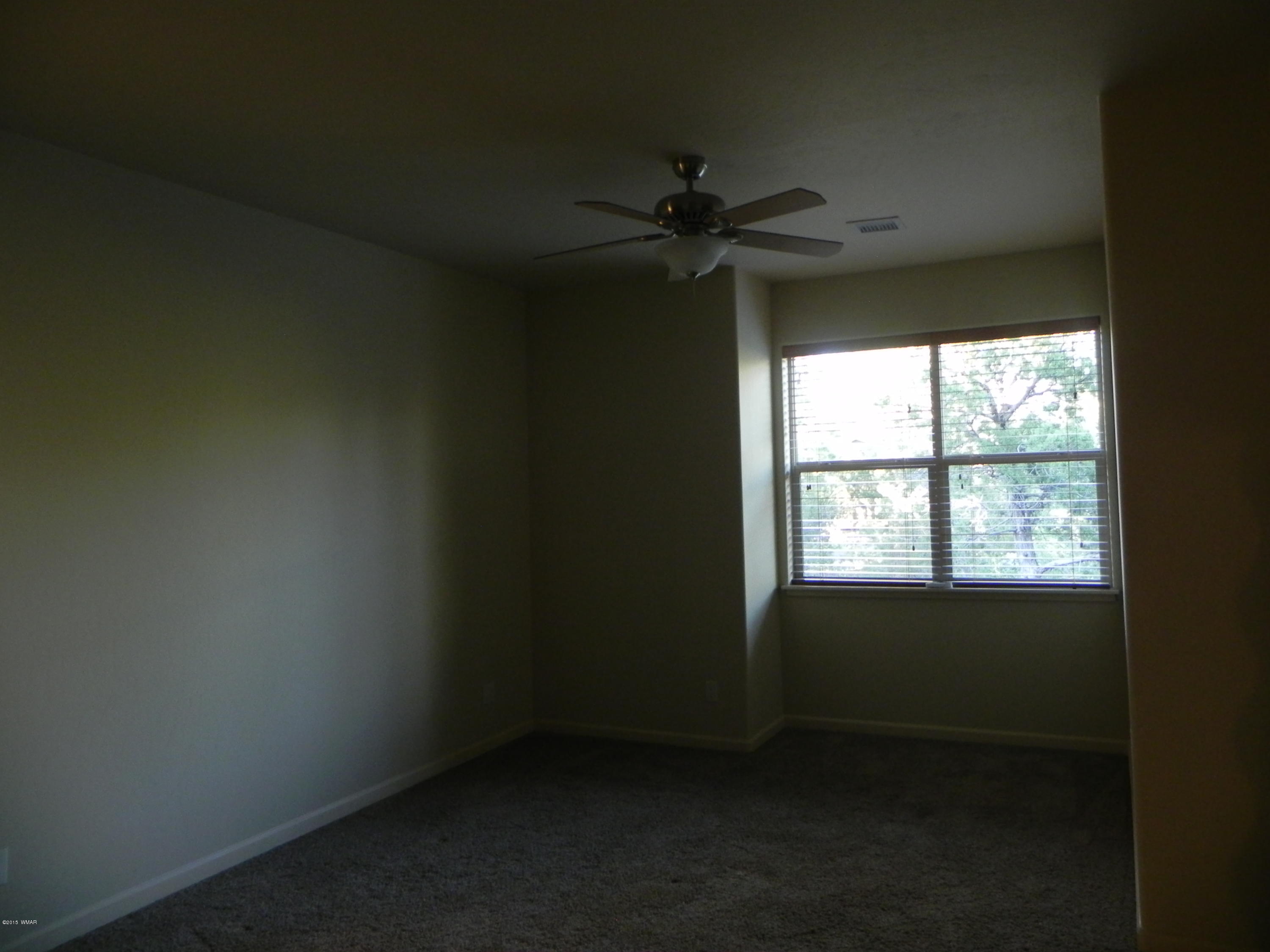 5975 Luminary Way Lakeside, AZ 85929 - Photo 32 of 44 an empty room with a window