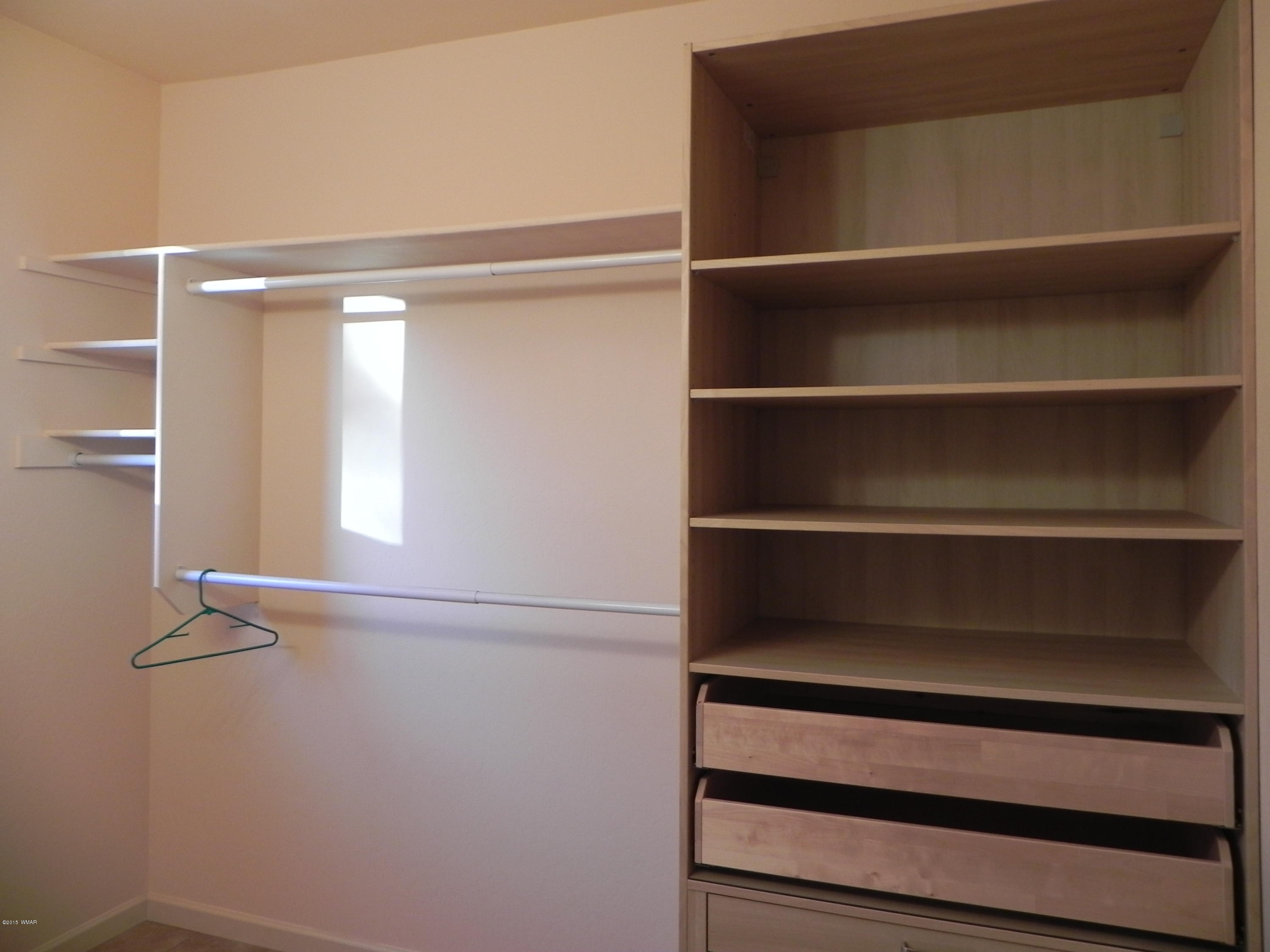 5975 Luminary Way Lakeside, AZ 85929 - Photo 39 of 44 a view of walk in closet with empty racks