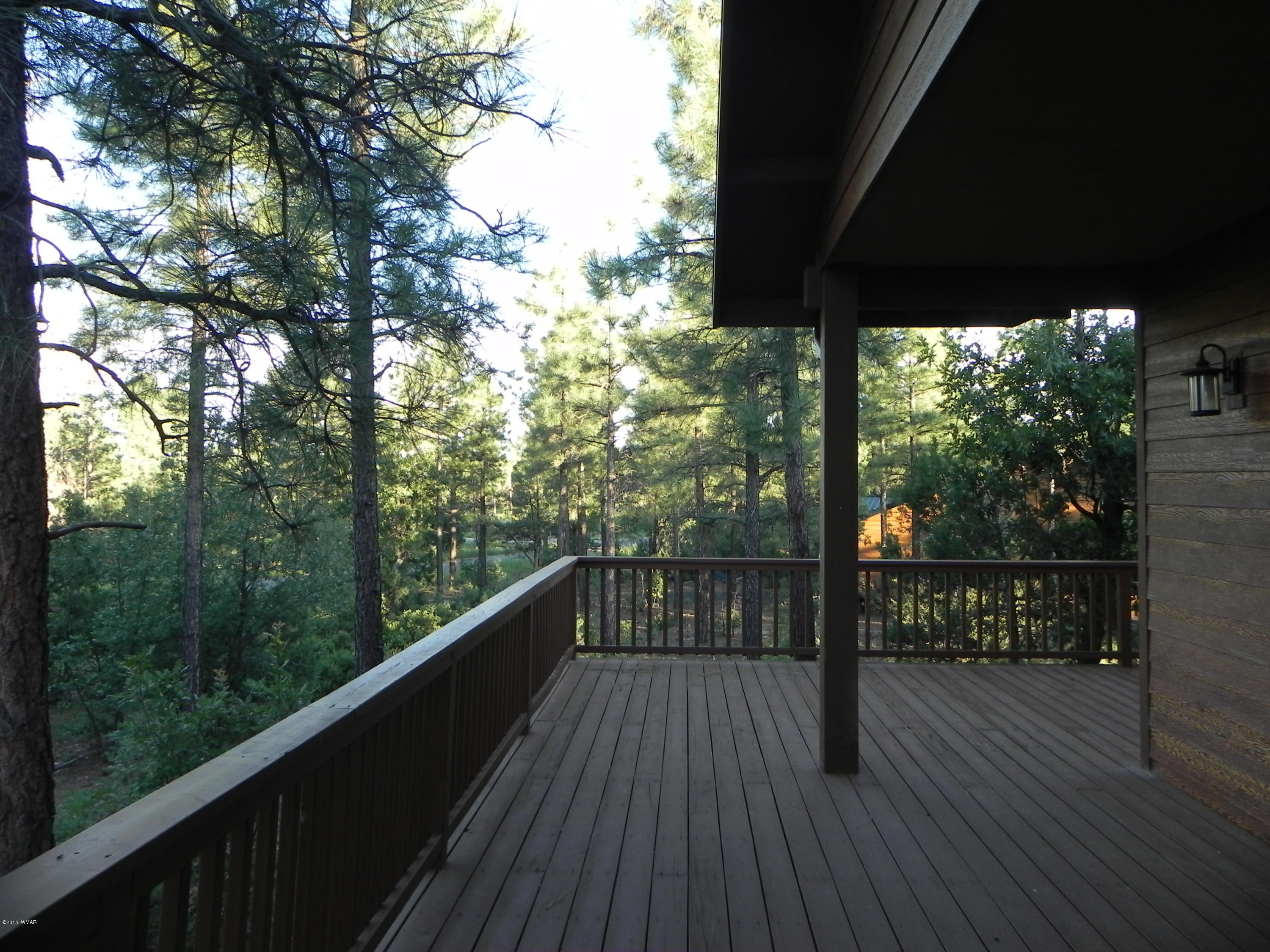 5975 Luminary Way Lakeside, AZ 85929 - Photo 40 of 44 a view of balcony with wooden floor and outdoor seating