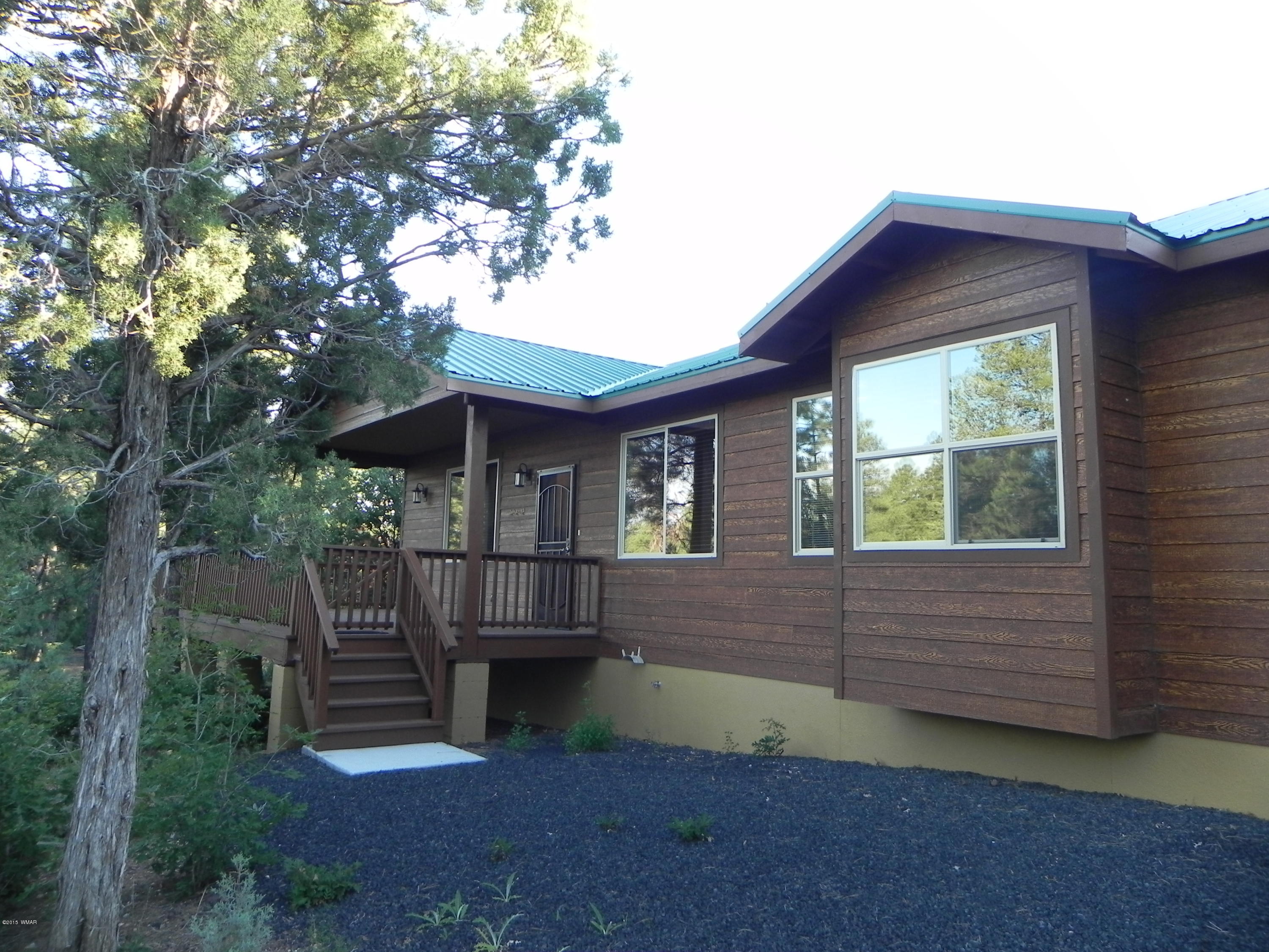 5975 Luminary Way Lakeside, AZ 85929 - Photo 42 of 44 a view of house with backyard