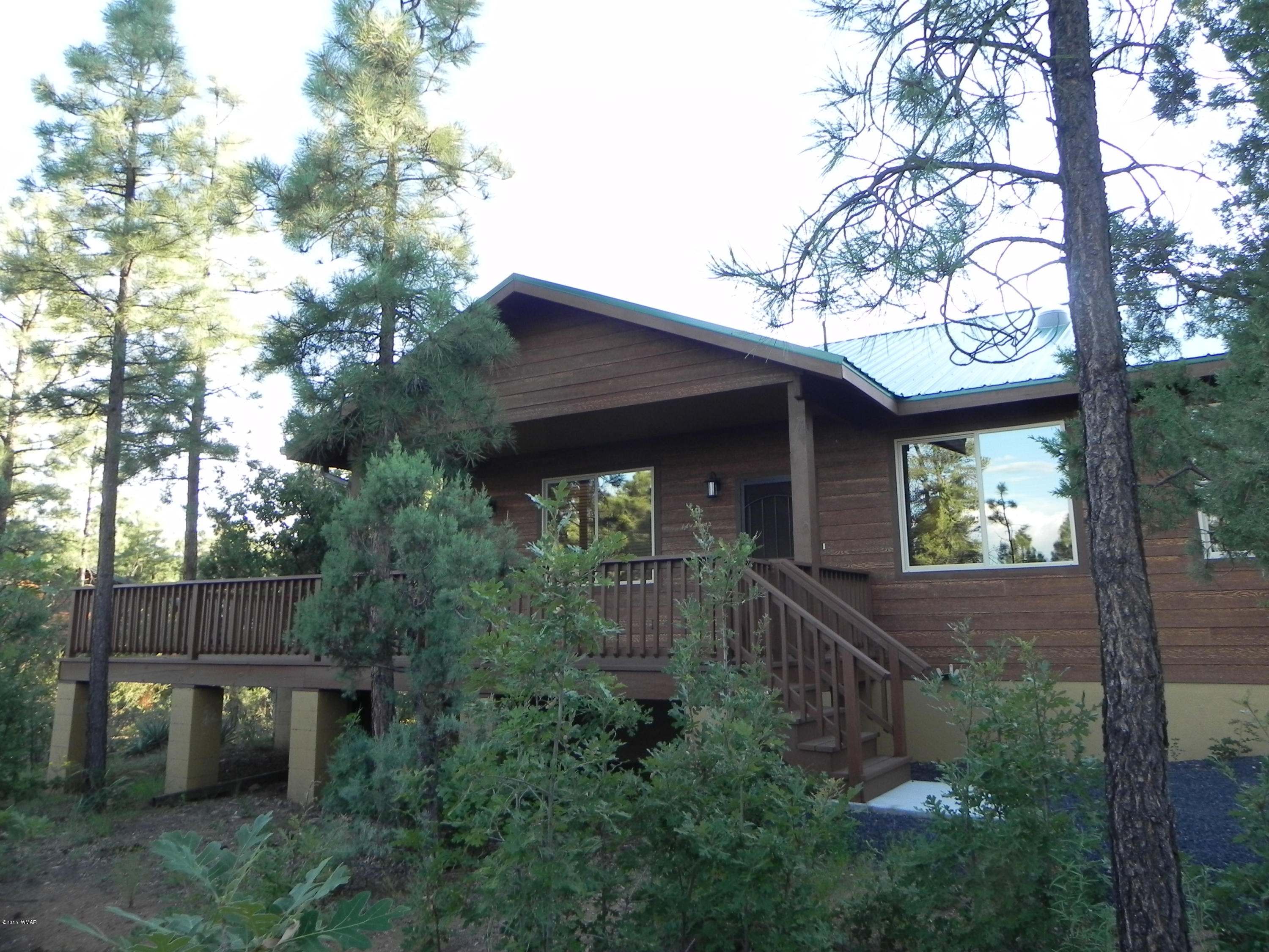 5975 Luminary Way Lakeside, AZ 85929 - Photo 43 of 44 a view of a house with a tree in the background