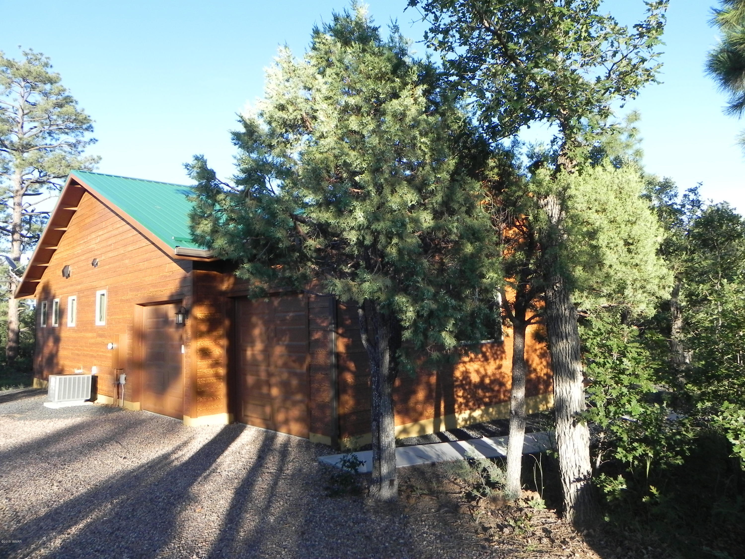 5975 Luminary Way Lakeside, AZ 85929 - Photo 6 of 44 a view of a house with a tree