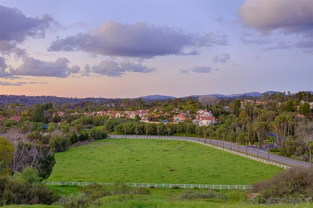 5872 Rancho Diegueno Road, Unit 15 Del Mar, CA 92014 - Photo 11 of 13 a view of a city with lush green forest