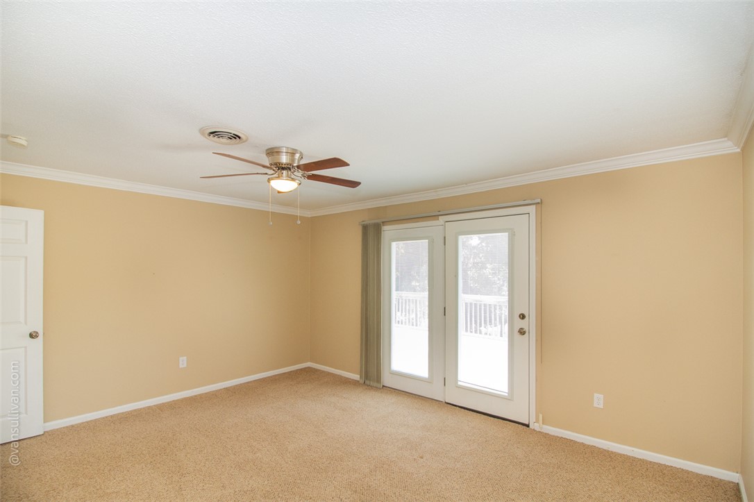 4518 Cove Trail Anderson, SC 29621 - Photo 23 of 49 Plush carpeting and elegant crown molding define this 2nd bedroom and versatile living space with an opening to the deck and scenic lake view.