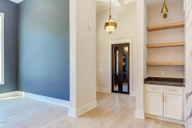 a view of cabinets and wooden floor