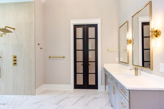 a bathroom with a sink and a mirror