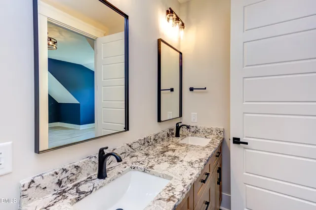 a view of empty room with wooden floor and fireplace
