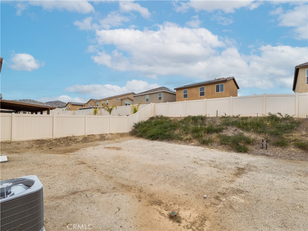 25602 Pne Rdg Road Homeland, CA 92548 - Photo 26 of 35 a view of a dry yard with wooden fence