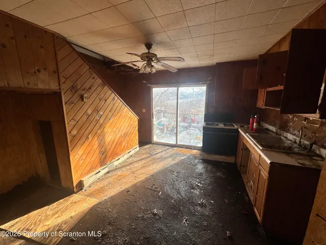 a view of a kitchen with a sink and a window