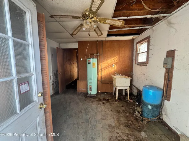 a view of a livingroom with furniture and a window