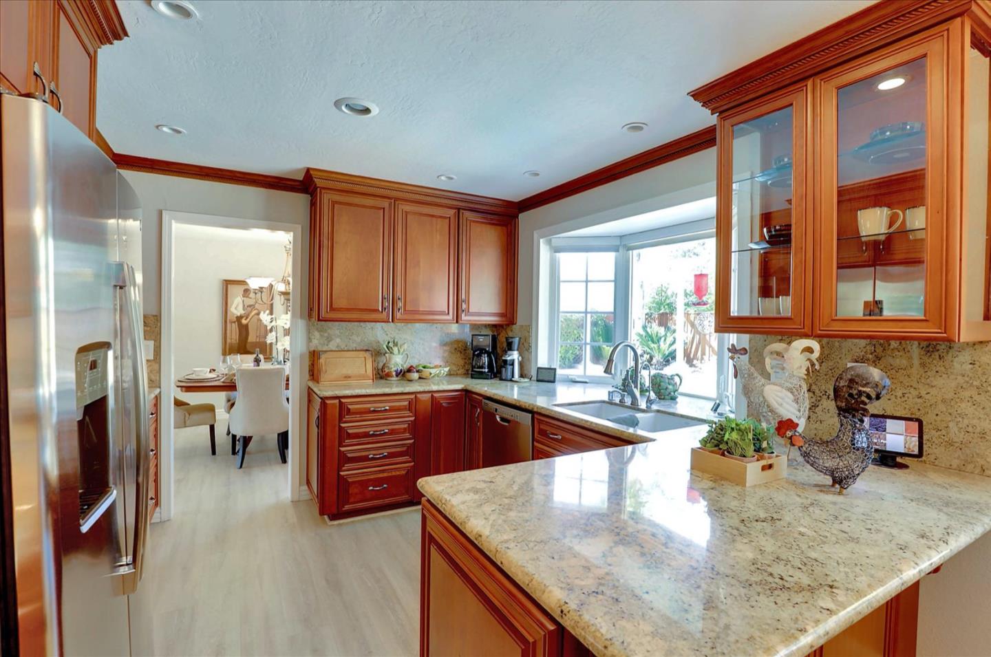 731 West 9th Street Gilroy, CA 95020 - Photo 13 of 37 a kitchen with stainless steel appliances granite countertop sink stove and refrigerator