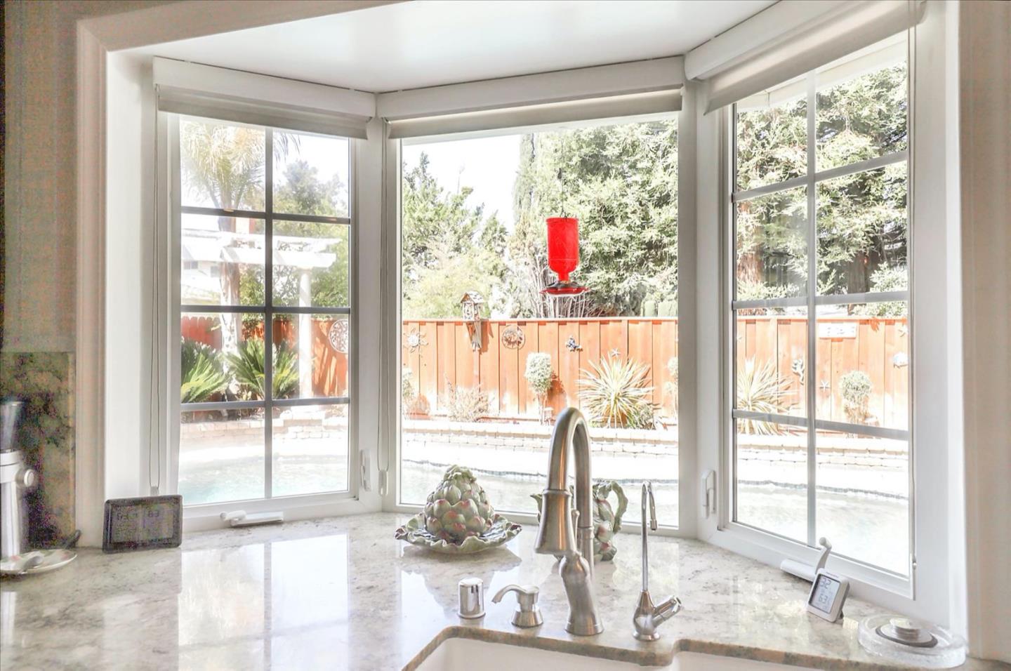 731 West 9th Street Gilroy, CA 95020 - Photo 15 of 37 a very nice looking room with a large window and a dining table