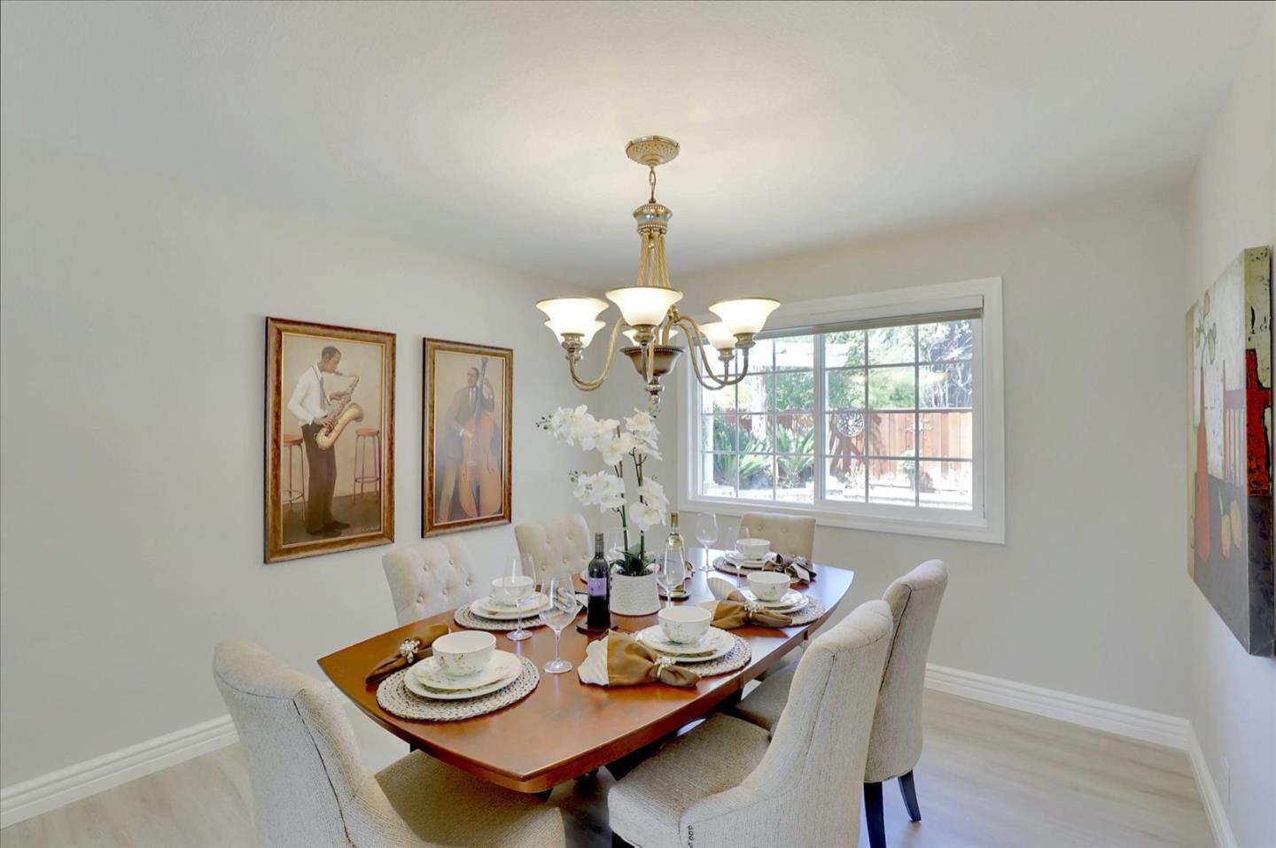 731 West 9th Street Gilroy, CA 95020 - Photo 16 of 37 a view of a dining room with furniture and chandelier