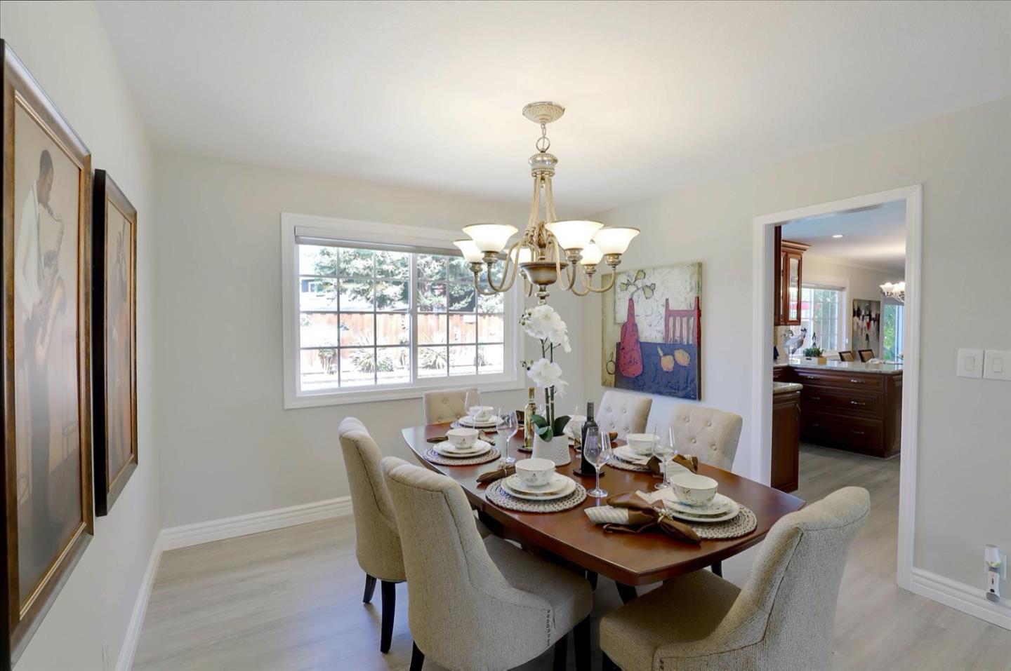 731 West 9th Street Gilroy, CA 95020 - Photo 17 of 37 a dining room with furniture a chandelier and window