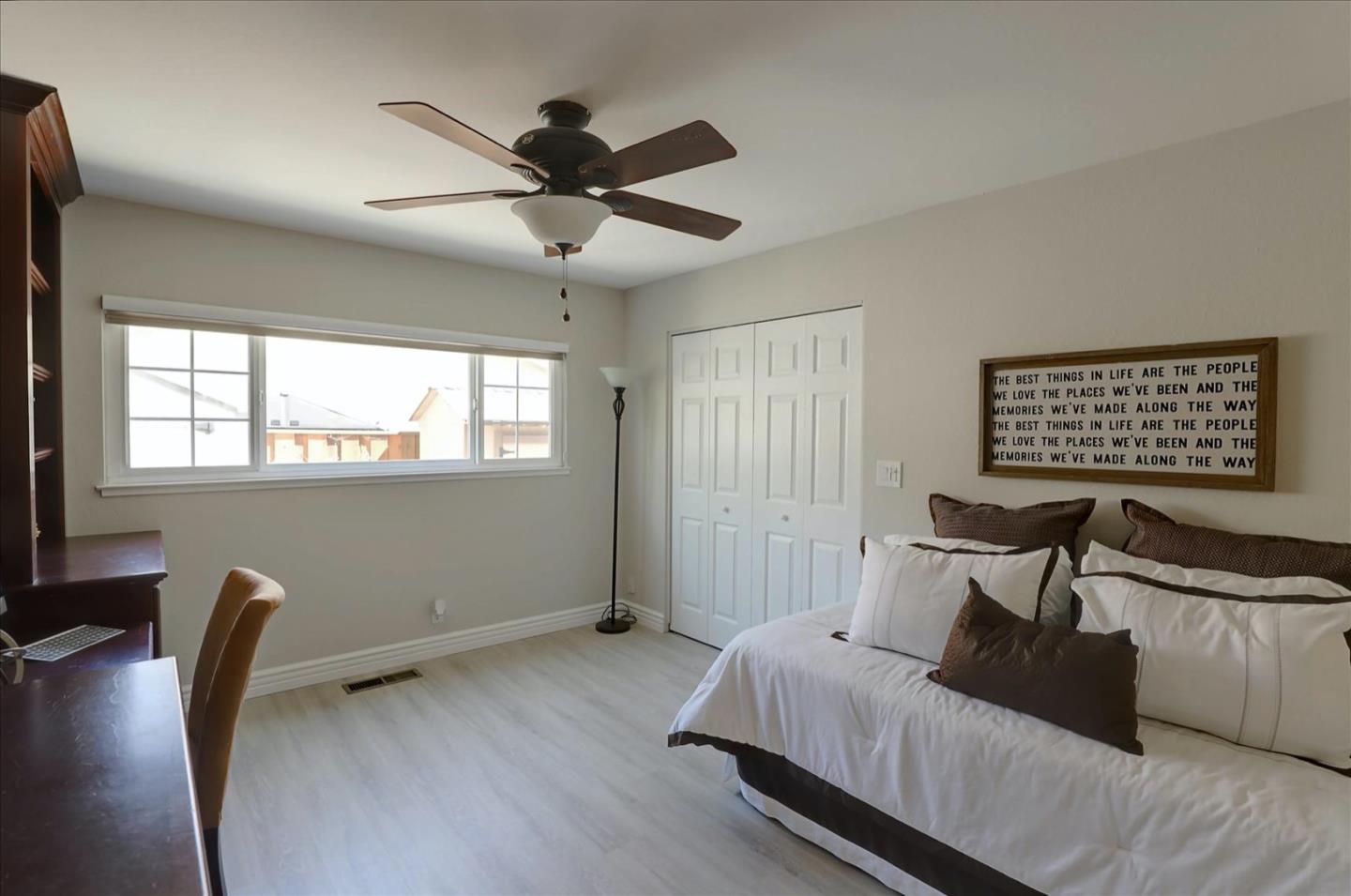 731 West 9th Street Gilroy, CA 95020 - Photo 20 of 37 a bedroom with a bed and a desk
