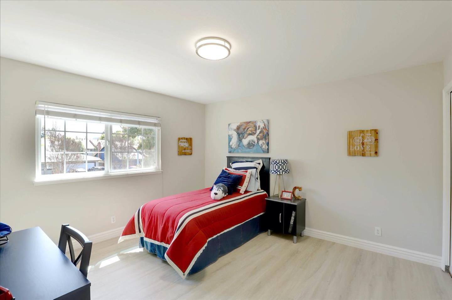 731 West 9th Street Gilroy, CA 95020 - Photo 23 of 37 a bedroom with a bed and a window