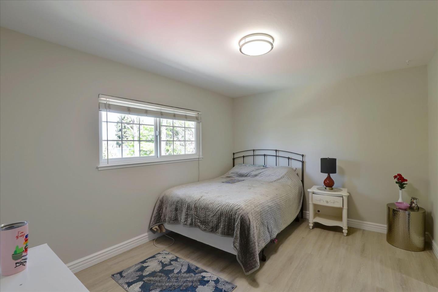 731 West 9th Street Gilroy, CA 95020 - Photo 25 of 37 a bedroom with a bed and a window