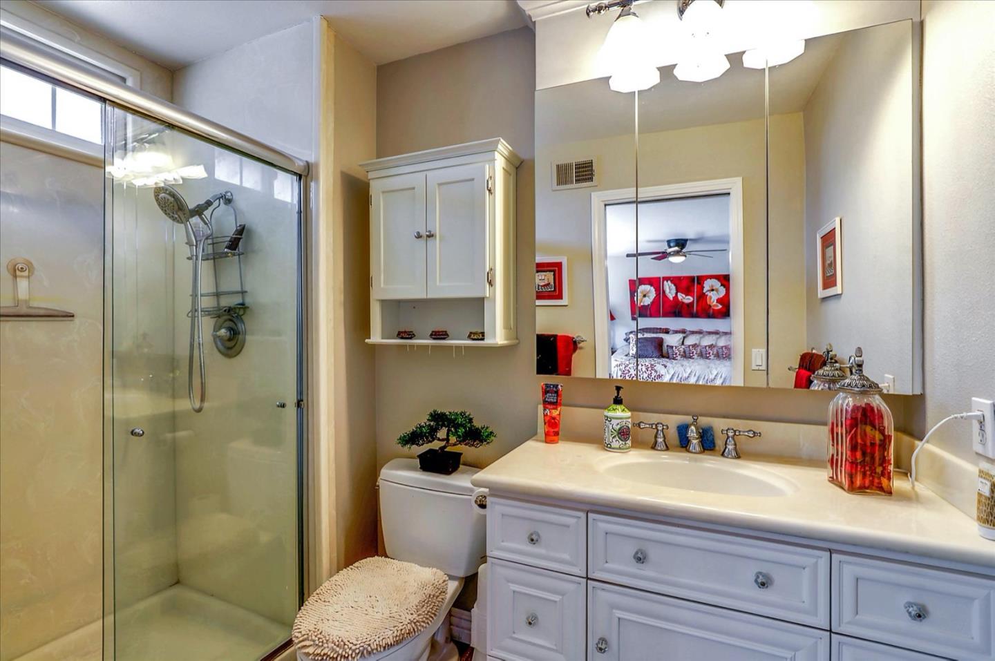 731 West 9th Street Gilroy, CA 95020 - Photo 28 of 37 a bathroom with a shower sink vanity granite and toilet