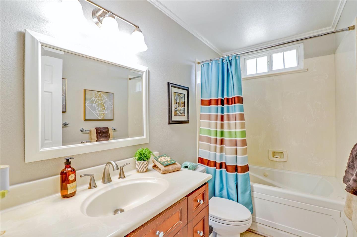 731 West 9th Street Gilroy, CA 95020 - Photo 29 of 37 a bathroom with a sink toilet and shower