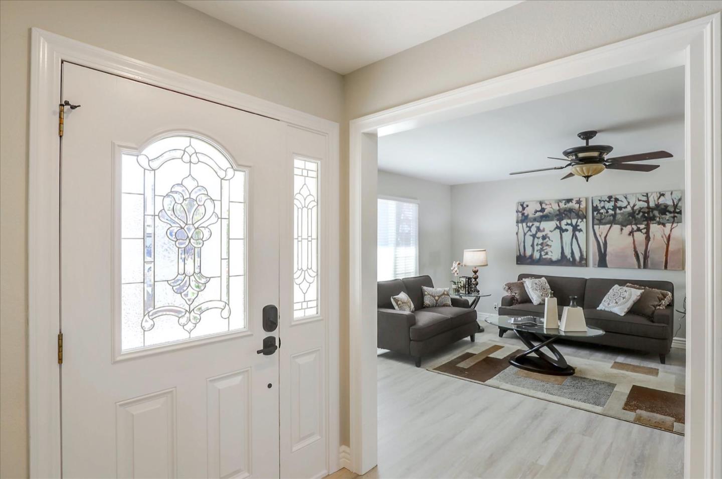 731 West 9th Street Gilroy, CA 95020 - Photo 5 of 37 a living room with furniture and a large window