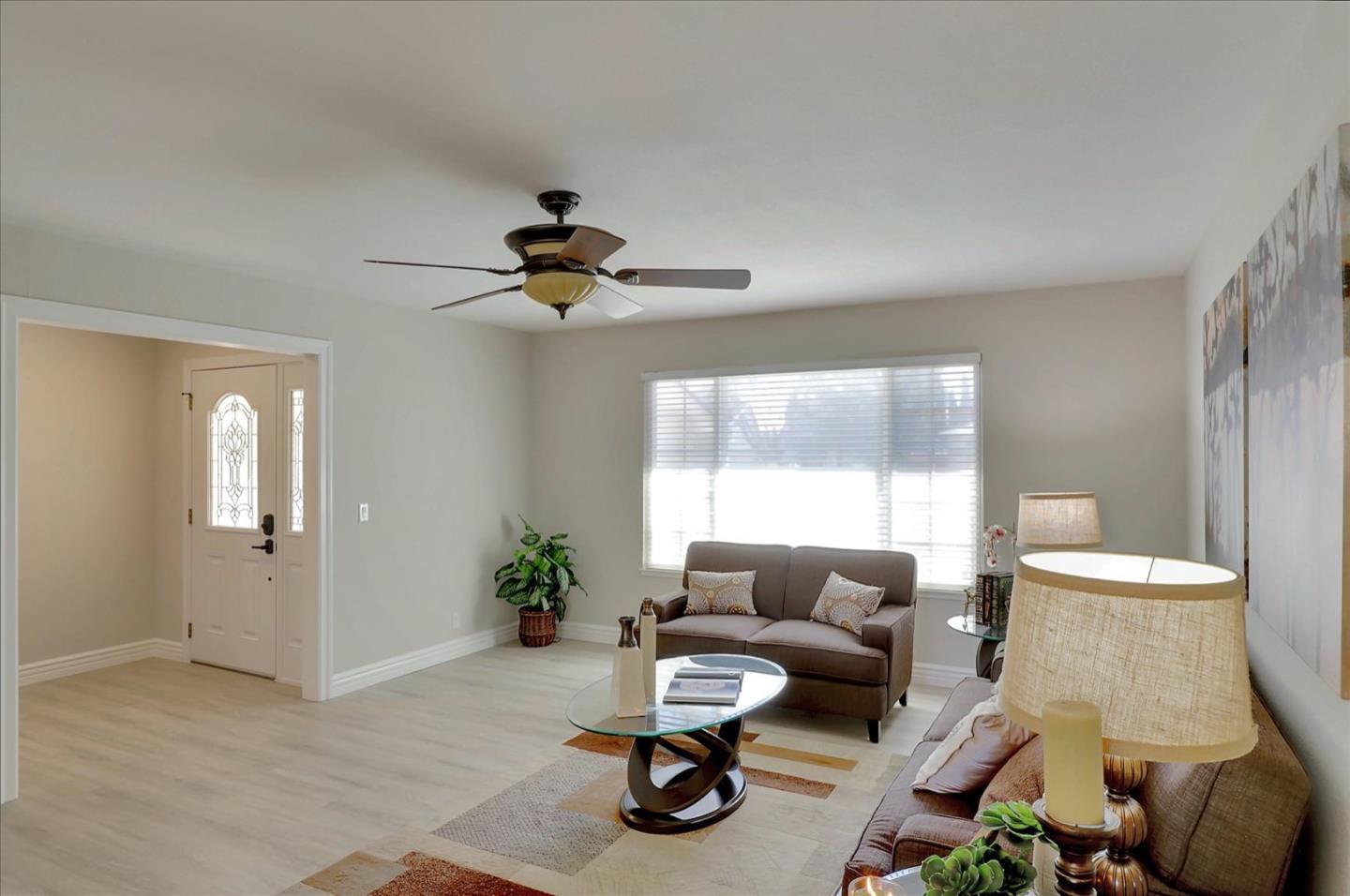 731 West 9th Street Gilroy, CA 95020 - Photo 7 of 37 a living room with furniture and a window