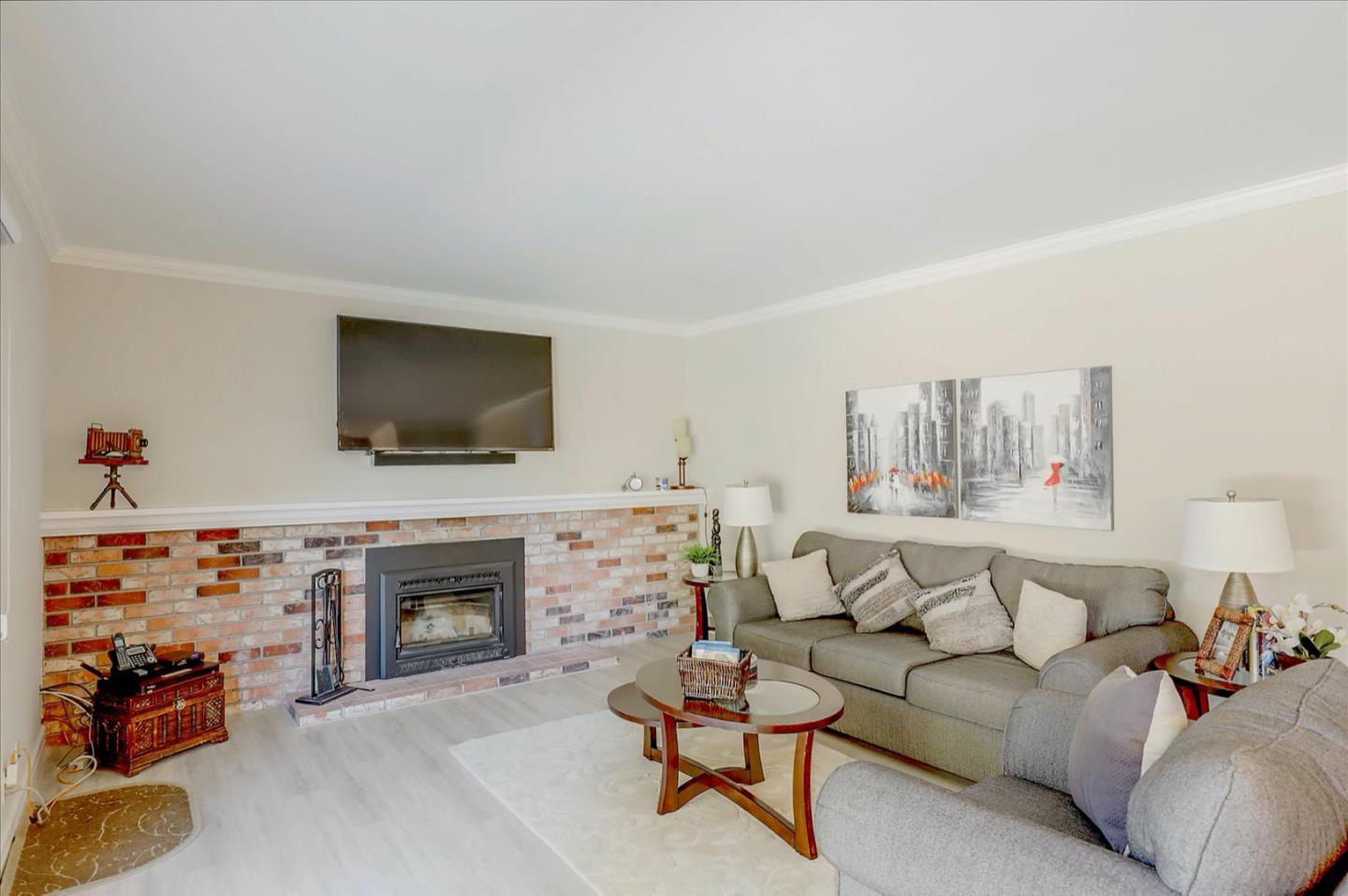 731 West 9th Street Gilroy, CA 95020 - Photo 10 of 37 a living room with furniture fireplace and flat screen tv