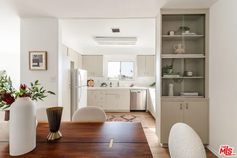 a kitchen with a sink stove and refrigerator