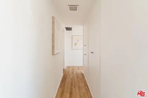 a bedroom with bed and a window