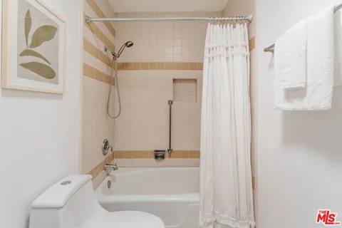 a view of a bathroom from the hallway