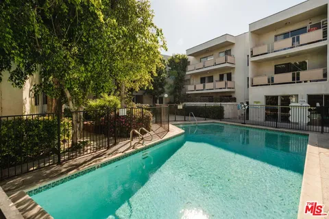 a view of a building with a garden