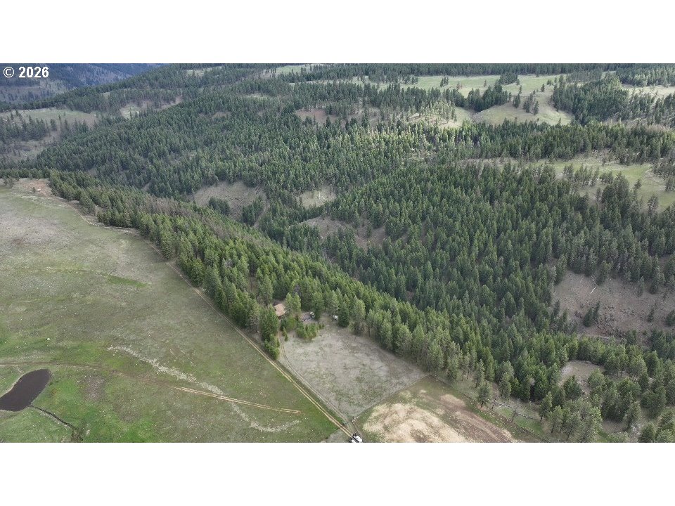 74759 Good Road Elgin, OR 97827 - Photo 2 of 7 a black and white photo of a road