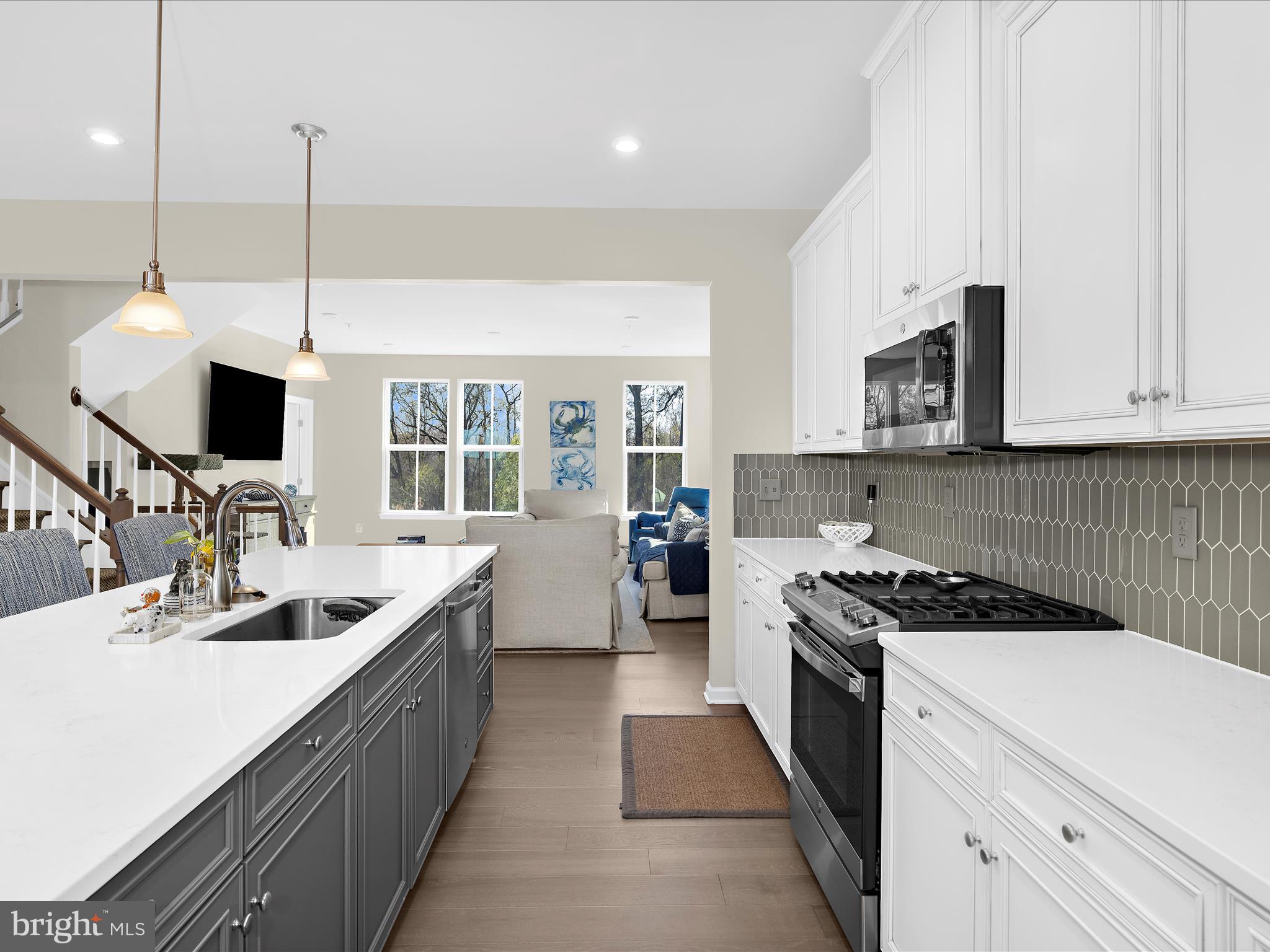 3100 Shaws Road Edgemere, MD 21219 - Photo 13 of 88 a kitchen that has a sink and a stove