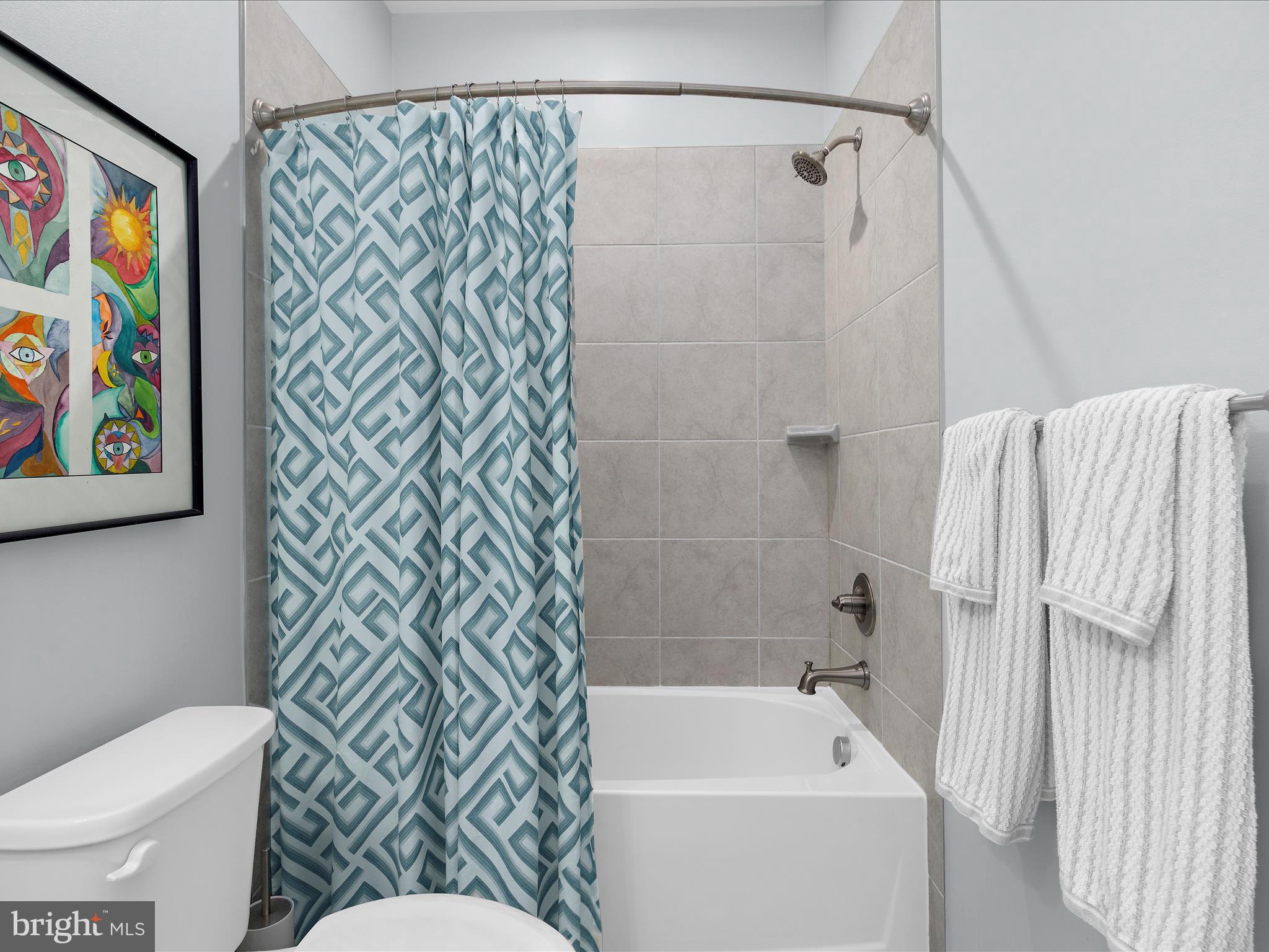 3100 Shaws Road Edgemere, MD 21219 - Photo 23 of 88 a bathroom with a toilet and a shower curtain