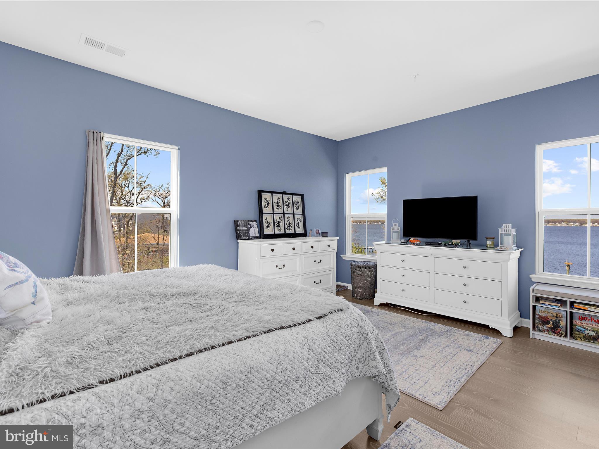 3100 Shaws Road Edgemere, MD 21219 - Photo 24 of 88 a bedroom with a bed and flat screen tv