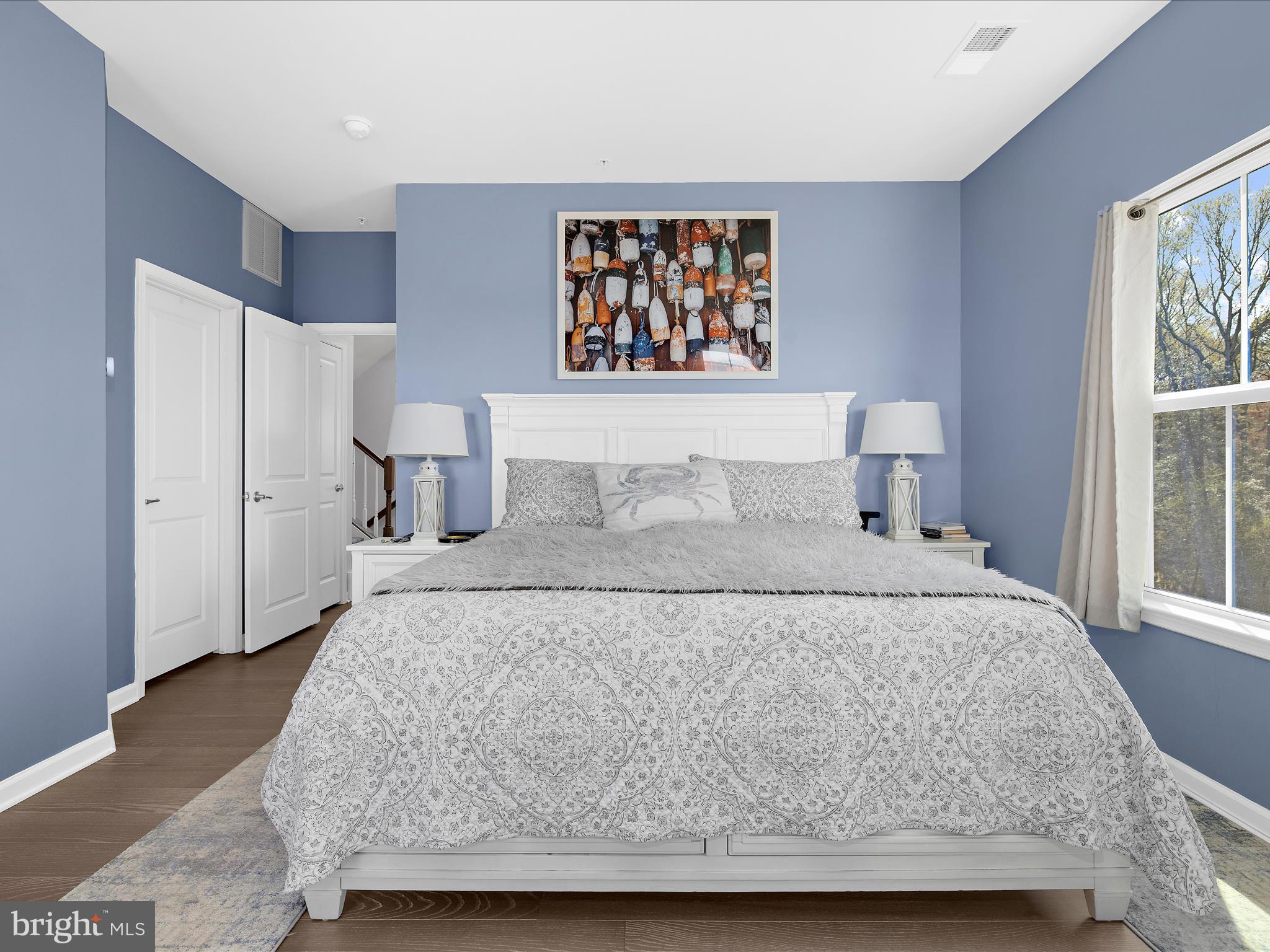 3100 Shaws Road Edgemere, MD 21219 - Photo 25 of 88 a bedroom with a bed and a painting on the wall