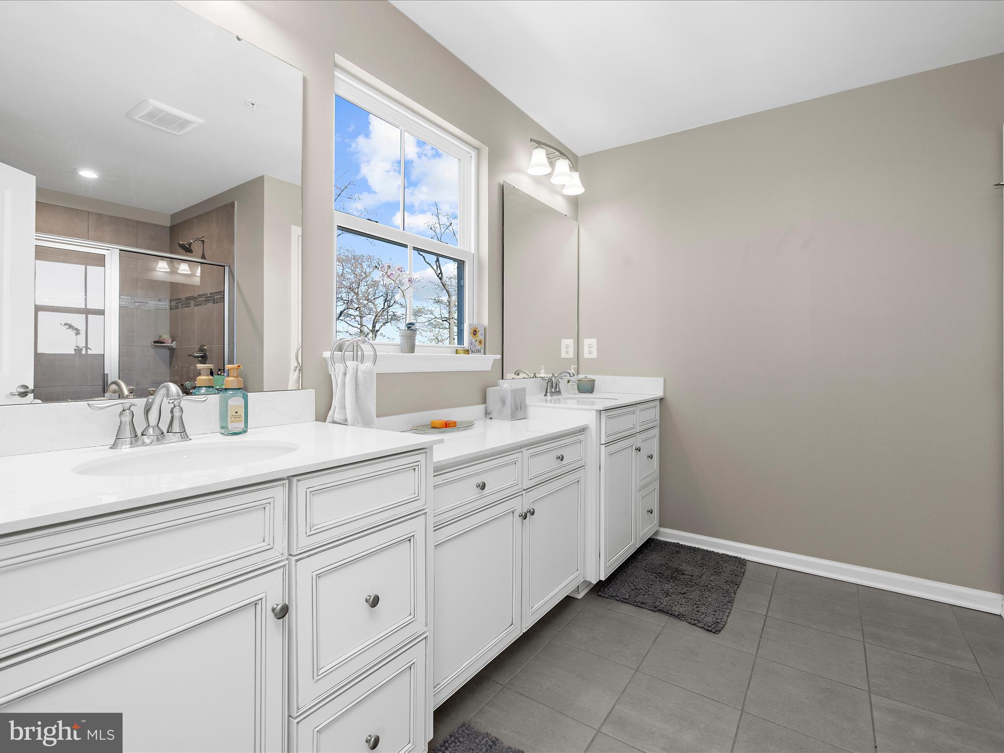 3100 Shaws Road Edgemere, MD 21219 - Photo 32 of 88 a spacious bathroom with double sink a mirror and a