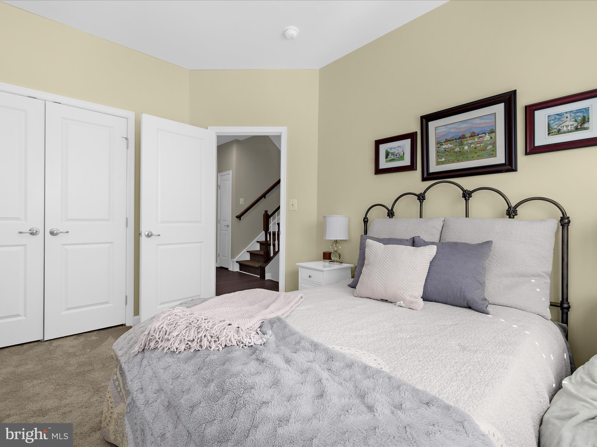 3100 Shaws Road Edgemere, MD 21219 - Photo 41 of 88 a bedroom with a large bed and a chandelier